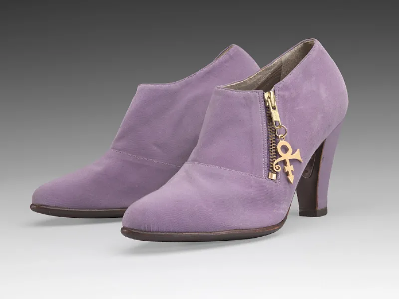 lavender heeled ankle boots  with Prince's Love Symbol as the zipper pull. 